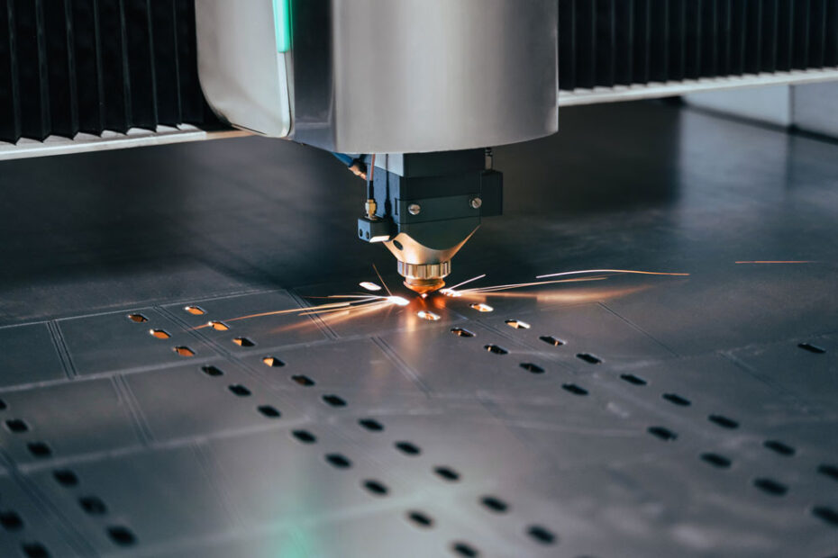 Close up of a laser cutter making precise cuts in a sheet of metal with the help of a nitrogen generator.