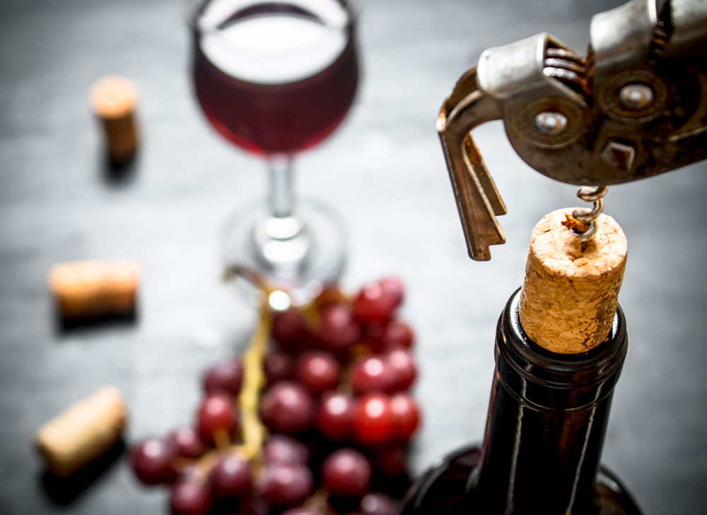 close up of red wine and grapes